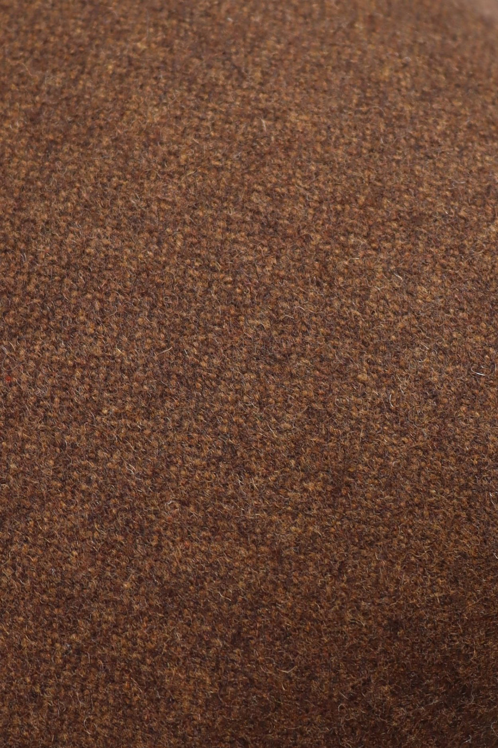 Een close up van een bruine wollen stof.