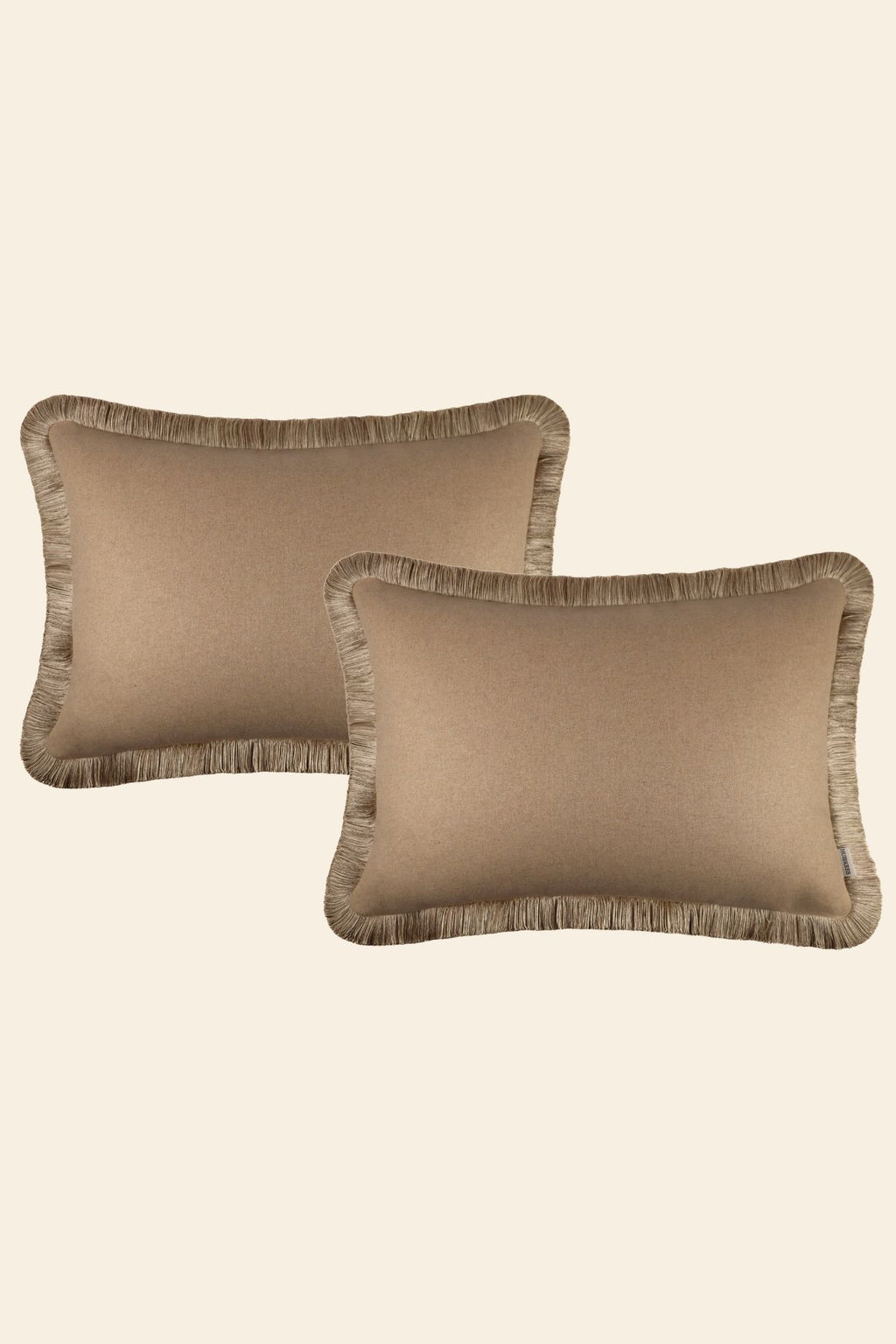 Set extra grote beige sierkussens met franjes.