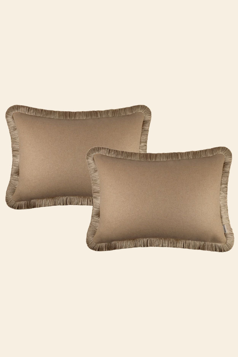Set extra grote beige sierkussens met franjes.