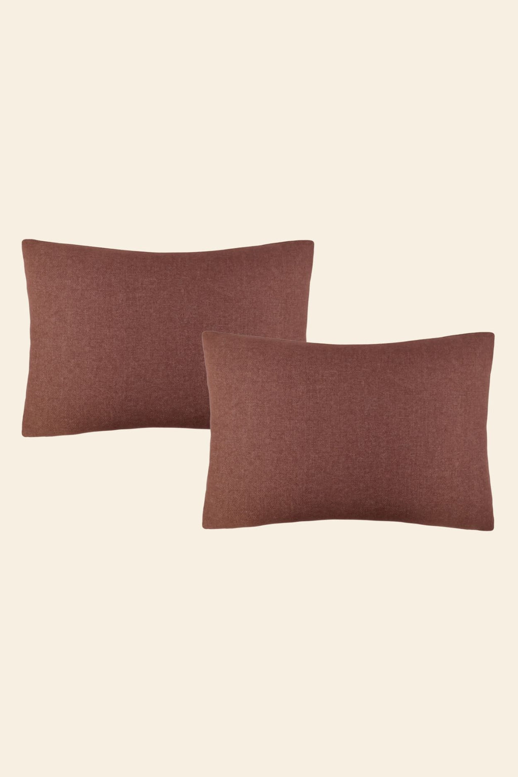 Twee roze extra grote sierkussens voor op bed.